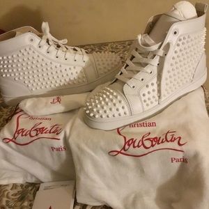 Christian Louboutin red bottoms, flat spikes